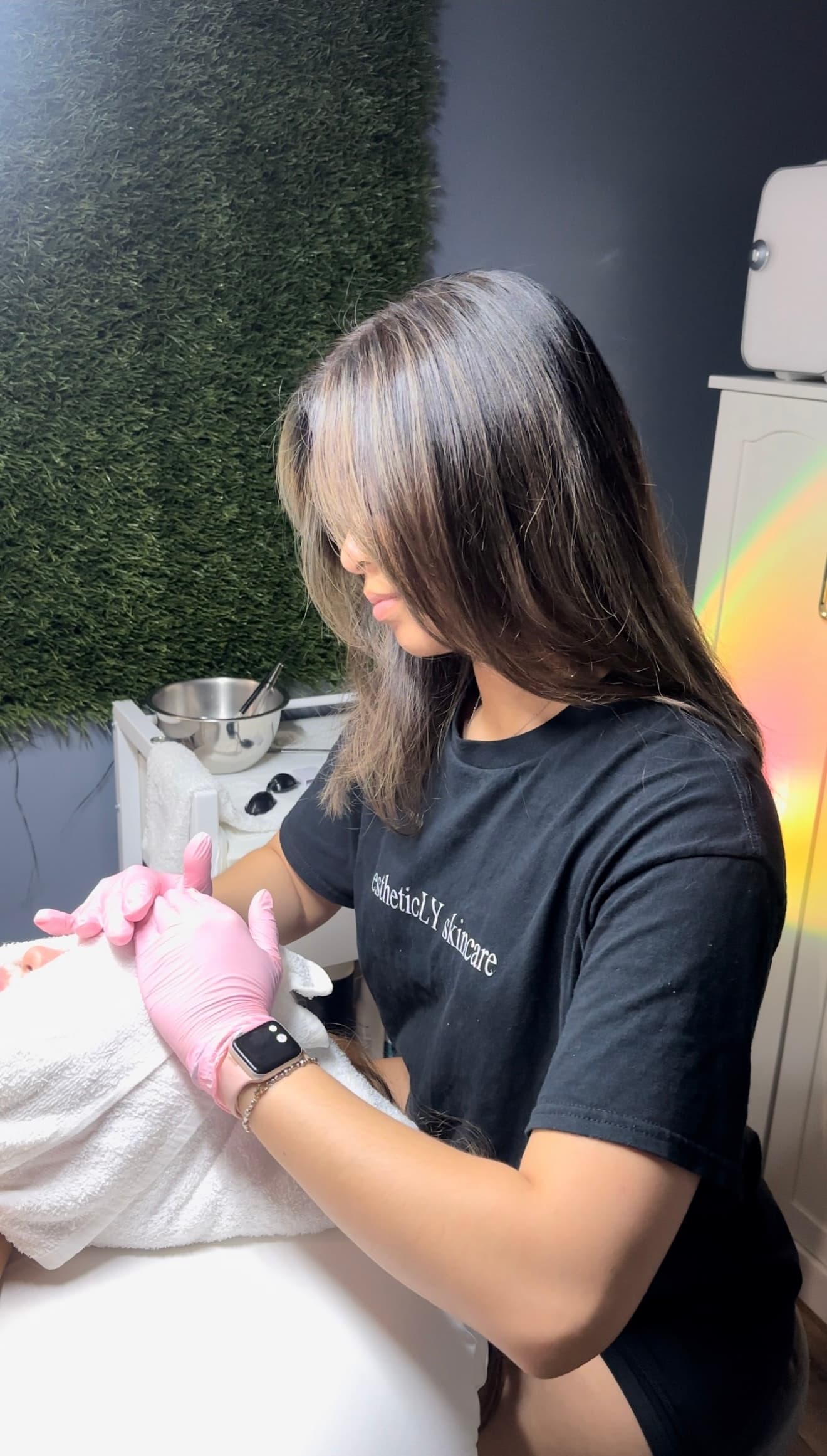 Esthetician performing a facial